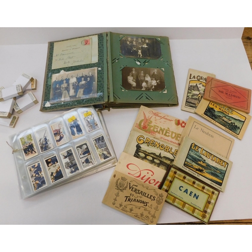 186 - Thirty eight pages of cigarette cards - & postcards