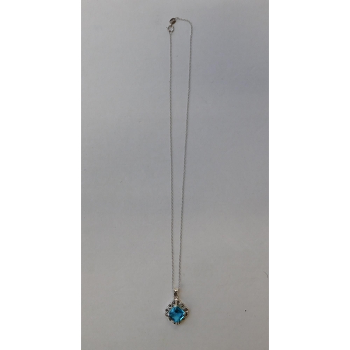 203 - Silver - blue topaz & marcasite pendant on silver chain