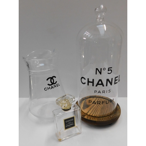 654 - Chanel glassware, water jug bell jar and perfume spray