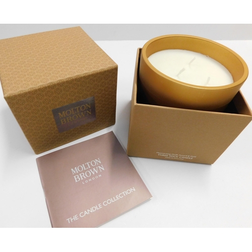 761 - New and boxed three wick Molton Brown candle - 
Mesmerising Oudh Accord and Gord