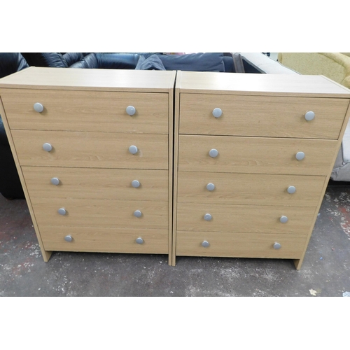 550A - Two five drawer chests of drawers