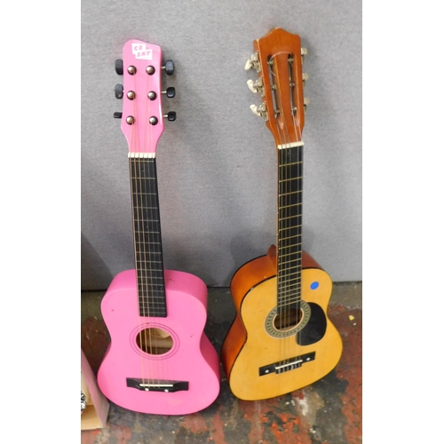 645 - Two children's acoustic guitars and one child's electric guitar