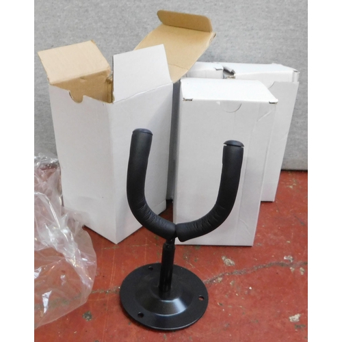 669 - Four wall hanging guitar stands