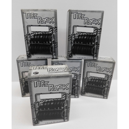 177 - Six sets of - vehicle tyres with rack/holder - for First Gear 1/34 scale models - packaged as new