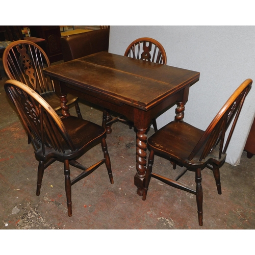 550 - Vintage oak fold-out table & four wheelback chairs