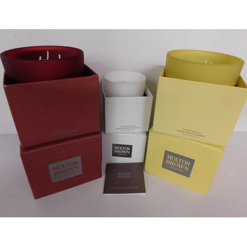 768 - Two new and boxed three wick Molton Brown candles; Rosa Absolute, Orange and Bergamot and single wic... 