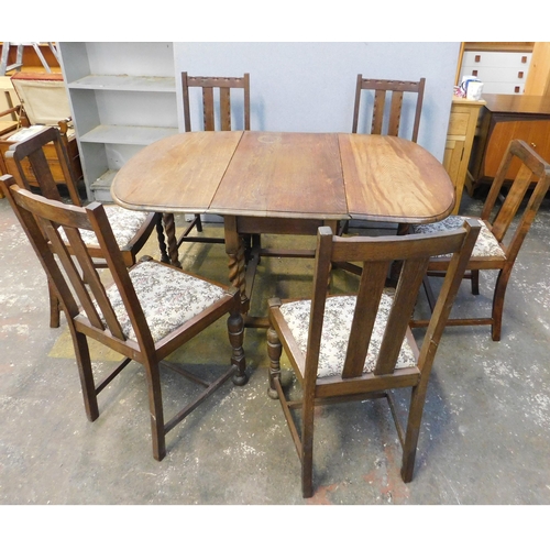 558 - Oak barley twist leg drop leaf table and six chairs