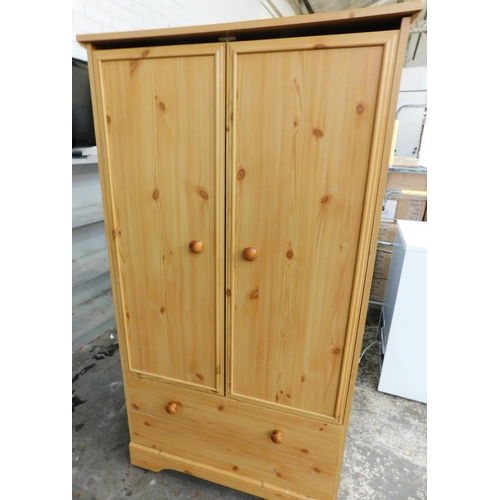 543 - Child's pine wardrobe with two drawers underneath