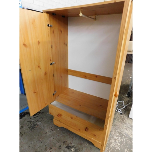 543 - Child's pine wardrobe with two drawers underneath