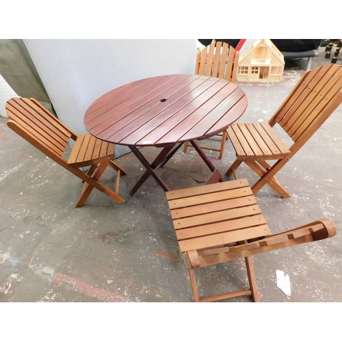 551 - Four folding chairs and circular folding garden table