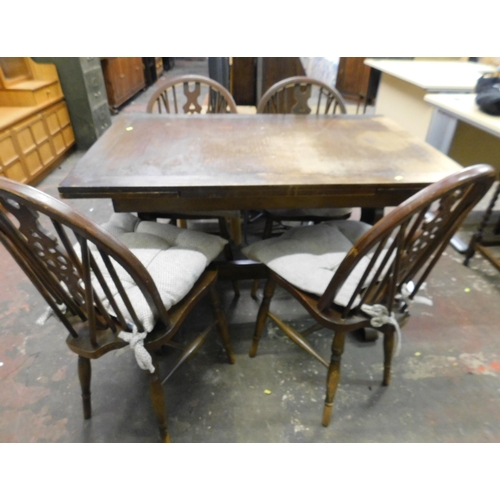 669A - Extending dining table and four wheel-back chairs