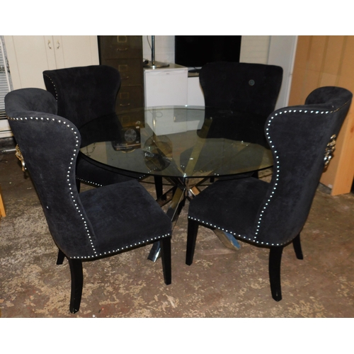 528 - Circular glass topped table and four chairs