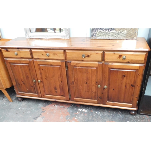 572 - Ducal 'Hampshire' pine four door sideboard