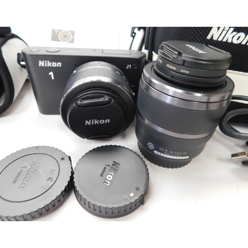 767 - Nikon- J1 digital camera with extra lens, accessories and instructions W/O