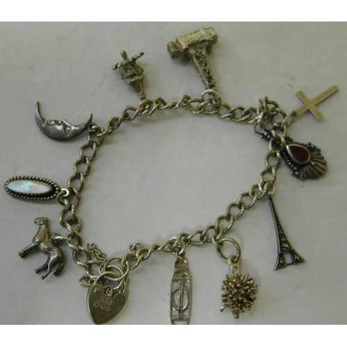 112 - Silver - charm bracelet & ten charms