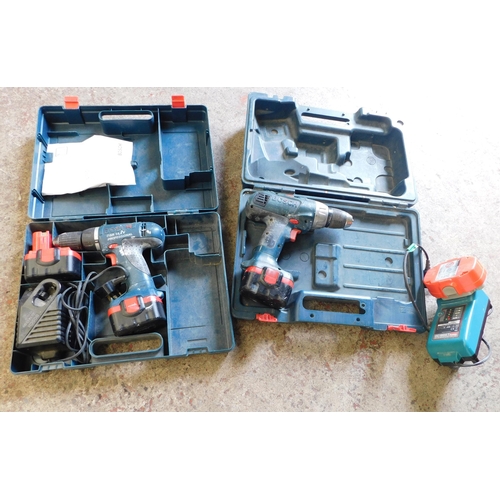 537 - Two boxed Bosch battery drills W/O incl. charger and Makita battery and charger (unchecked)