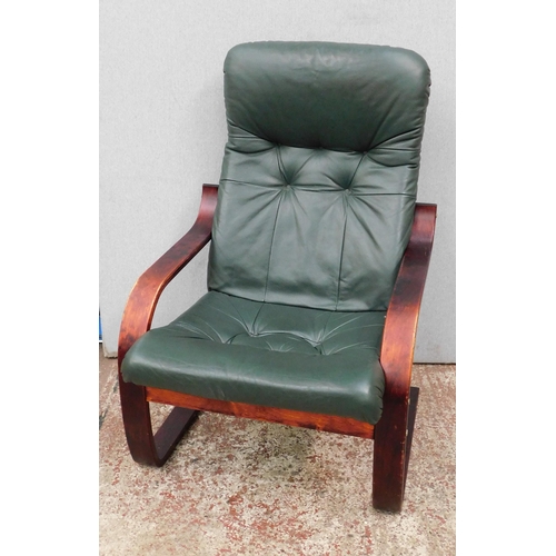 551 - Button backed green leather style easy chair