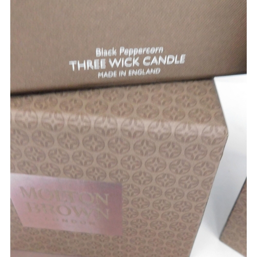 759 - Two new and boxed Molton Brown candles, three wick and single wick - Black Peppercorn