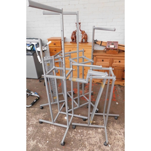 558 - Four metal shop display stands