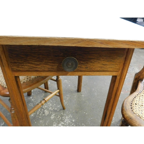 592 - Vintage melamine table and two rattan chairs