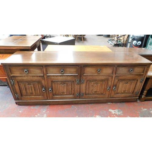 822 - Four door / four drawer oak sideboard