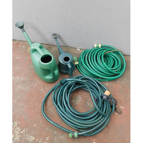 510 - Two hosepipes and two watering cans