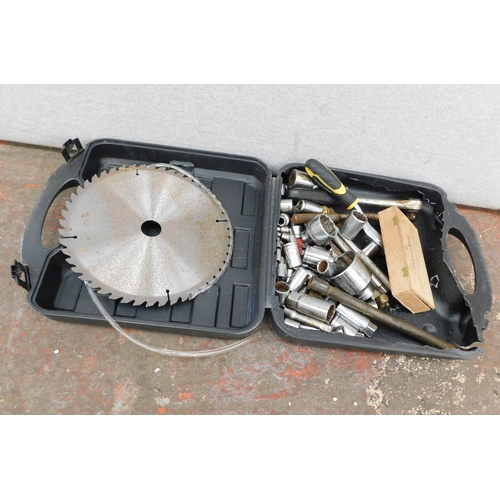 518 - Box of various sockets and circular saw blade