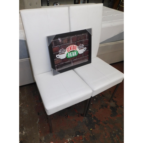 563 - Two dining chairs and framed Central Perk Friends picture