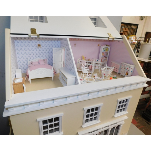 553 - Three storey dolls house with large amount of accessories - porcelain fittings and upholstered furni... 