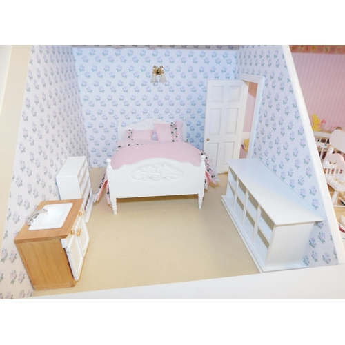 553 - Three storey dolls house with large amount of accessories - porcelain fittings and upholstered furni... 