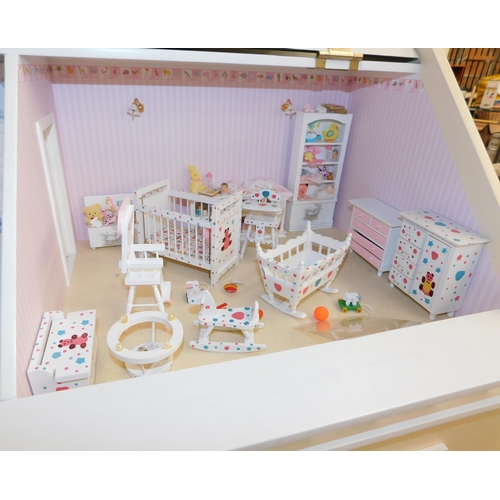 553 - Three storey dolls house with large amount of accessories - porcelain fittings and upholstered furni... 