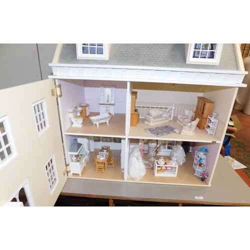 553 - Three storey dolls house with large amount of accessories - porcelain fittings and upholstered furni... 