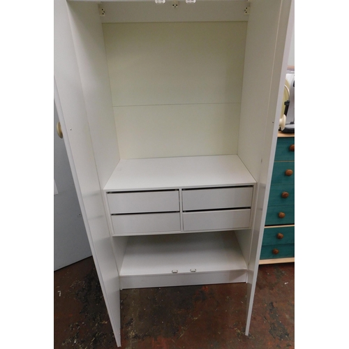 580A - Double wardrobe with storage section inside