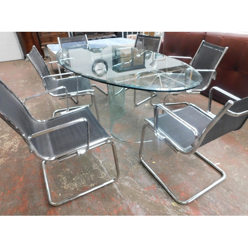 555 - Large glass dining/ conference table and six chairs