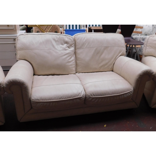 586 - Cream leather two seater settee and two armchairs