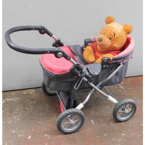 806 - Dolls pushchair + Winnie the Pooh soft toy