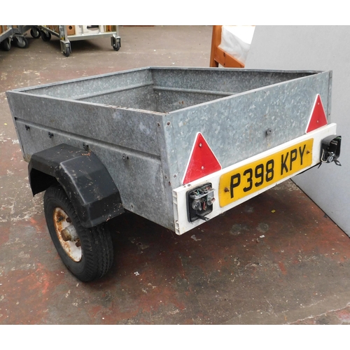 813 - Small metal trailer 34