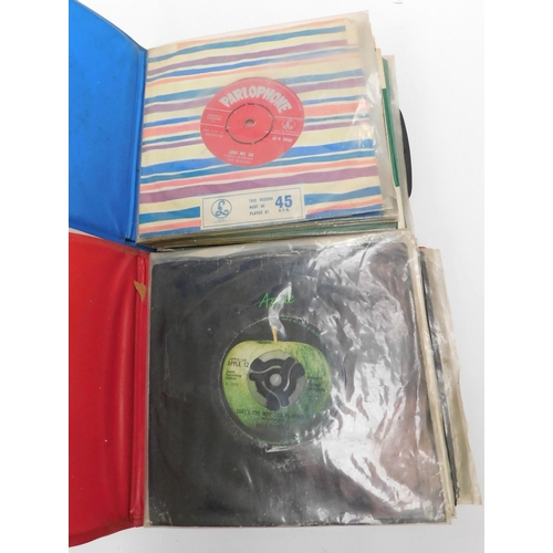 16 - Two/folders containing - The Beatles & related artist/45s - including first press