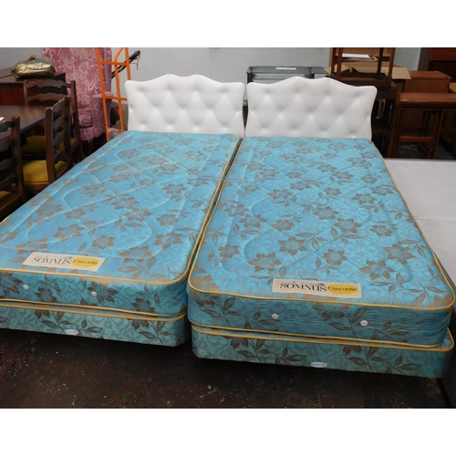 562 - Two single beds with mattress's and headboards