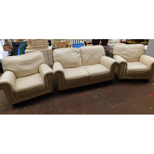 569 - Cream leather two seater settee and two armchairs