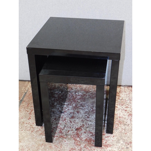 654 - Contemporary black glass nesting tables