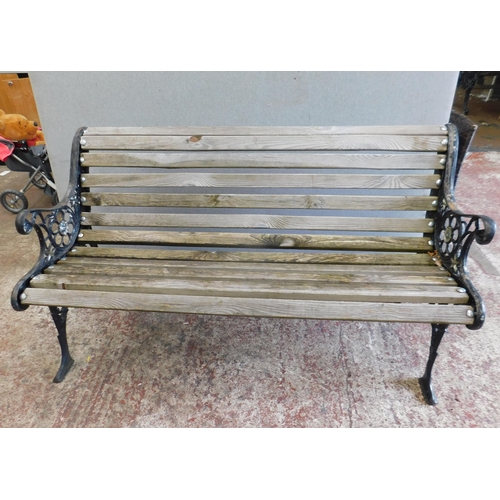 658 - Garden bench with cast ends