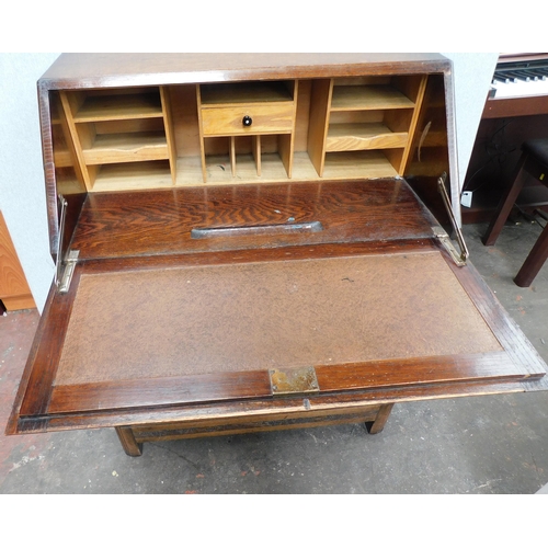 675 - Oak three drawer bureau