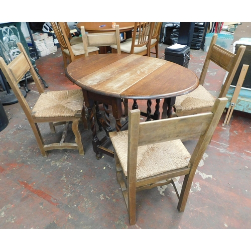 564 - Drop leaf oak table and four chairs