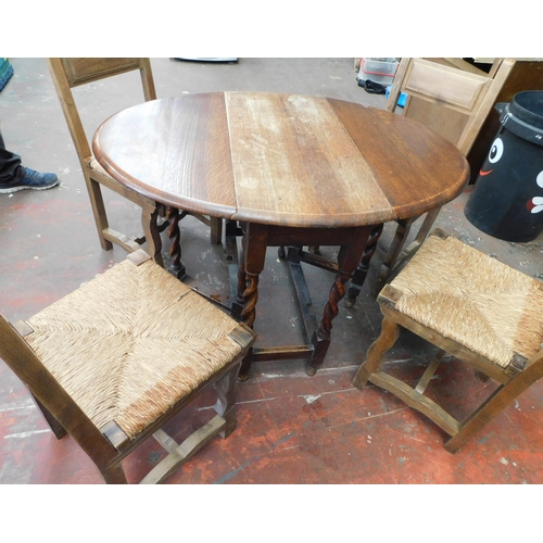 564 - Drop leaf oak table and four chairs