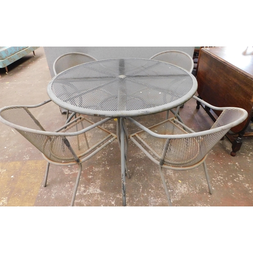 565 - Metal garden table and four chairs