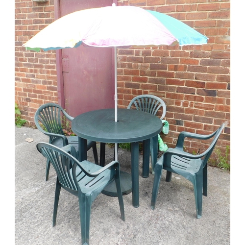 566 - Plastic patio set incl. four chairs, table, parasol and stand