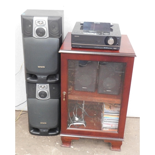 586 - Sony Giga-juke music system with speakers, cabinet, remote etc.