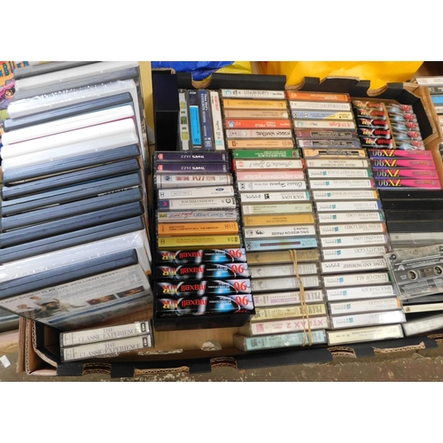 702 - Box of cassettes/DVDs