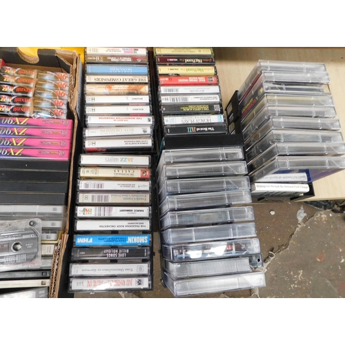 702 - Box of cassettes/DVDs